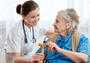© Alexander Raths - fotolia.com Senior woman is visited by her doctor or caregive