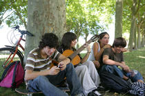 Group of teenage friends gathered in the park