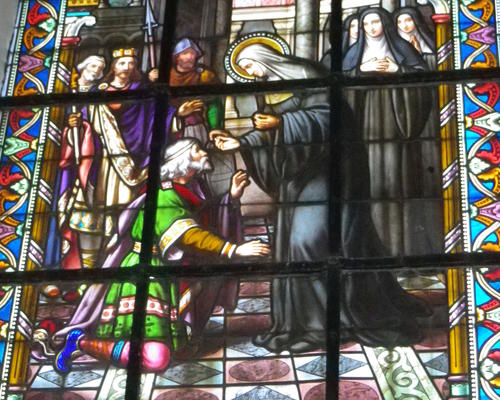 Ruodgaire demande l'intercession de Berthe pour recouvrer la vue, qu'il avait perdue en calomniant Berthe. Cette scène symbolise le repentir de cet officier du roi mérovingien Thierry III.